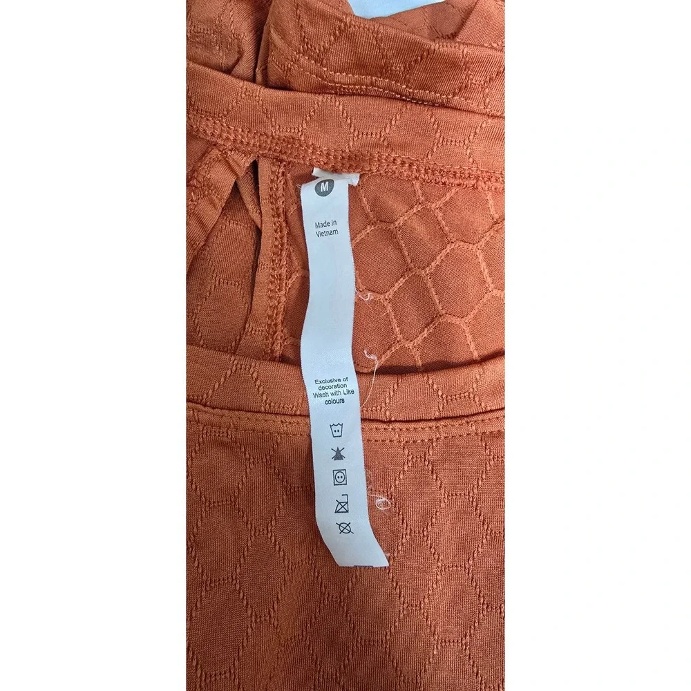 alo women M short sleeve textured boxy shirt orange athletic yoga sport